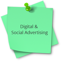 A green post it note with the words digital and social advertising on top.
